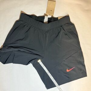 Nike black Athletic Shorts with red Swoosh
